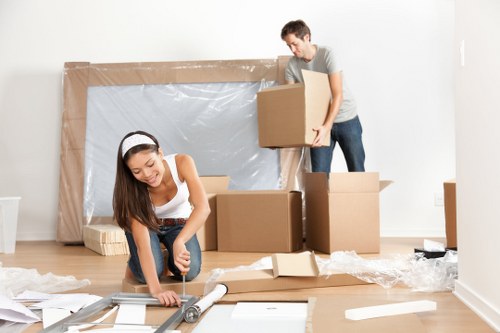 Removal team preparing a Westminster flat move with boxes and furniture