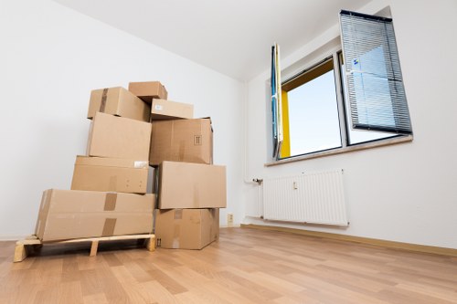 Moving van and packed household items ready for transport