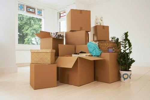 Movers protecting furniture and boxes during a house removal in Westminster