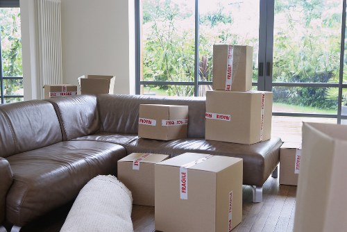 Furniture and boxes being loaded into a removal van in Westminster